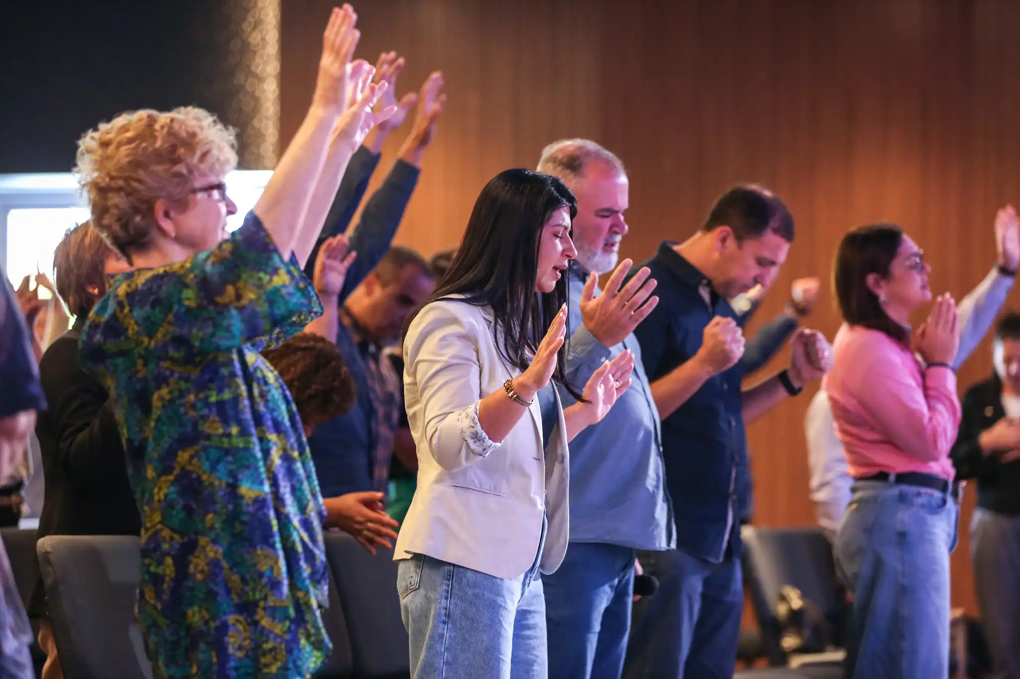 Leah Yoder and People worshiping at Marvin Yoder service